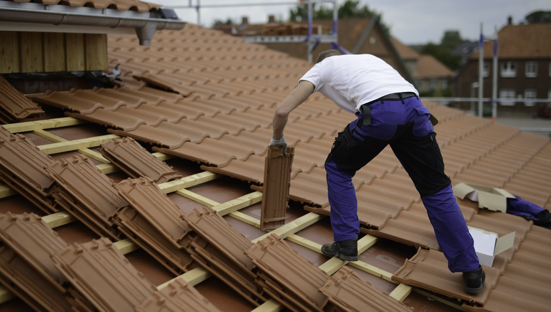 Eastern Roofing roofer fitting battens on a stripped roof