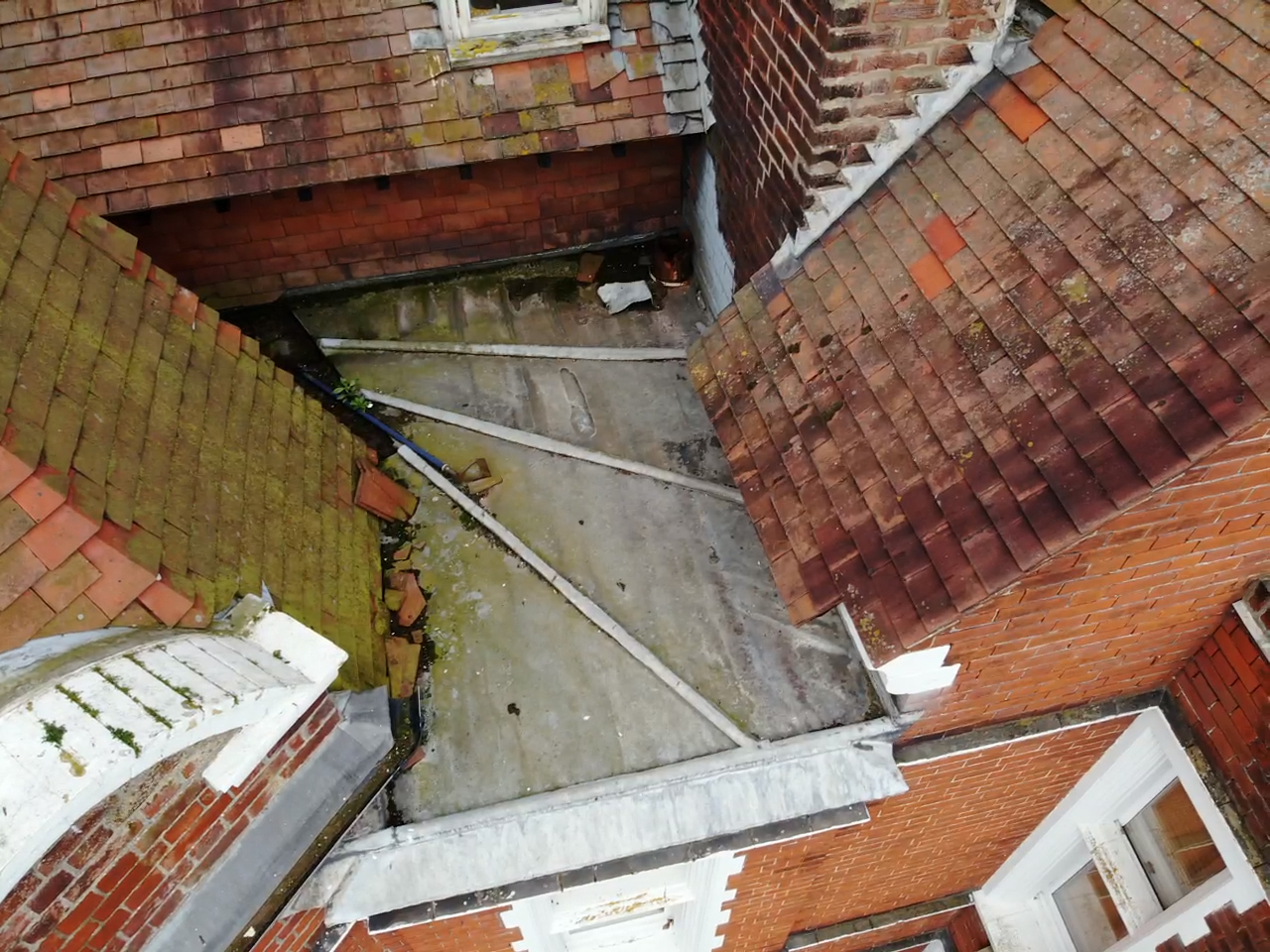 Aerial inspection of roof junctions and a flat roof
